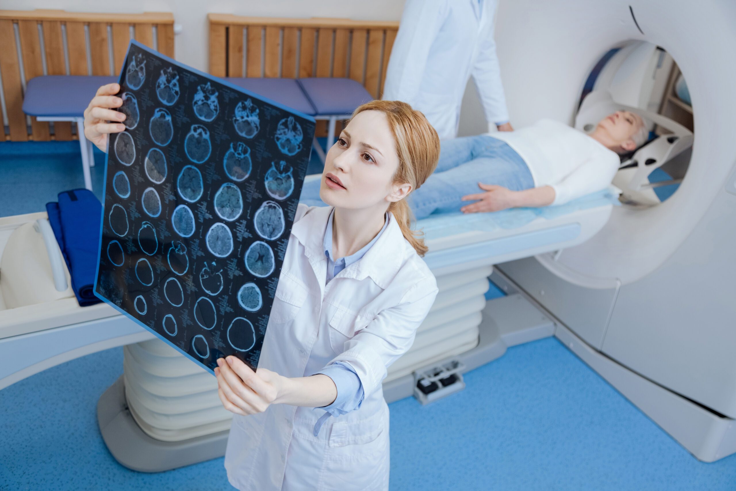 Beautiful female radiologist looking at the MRI scan images Extreme Sports Bike